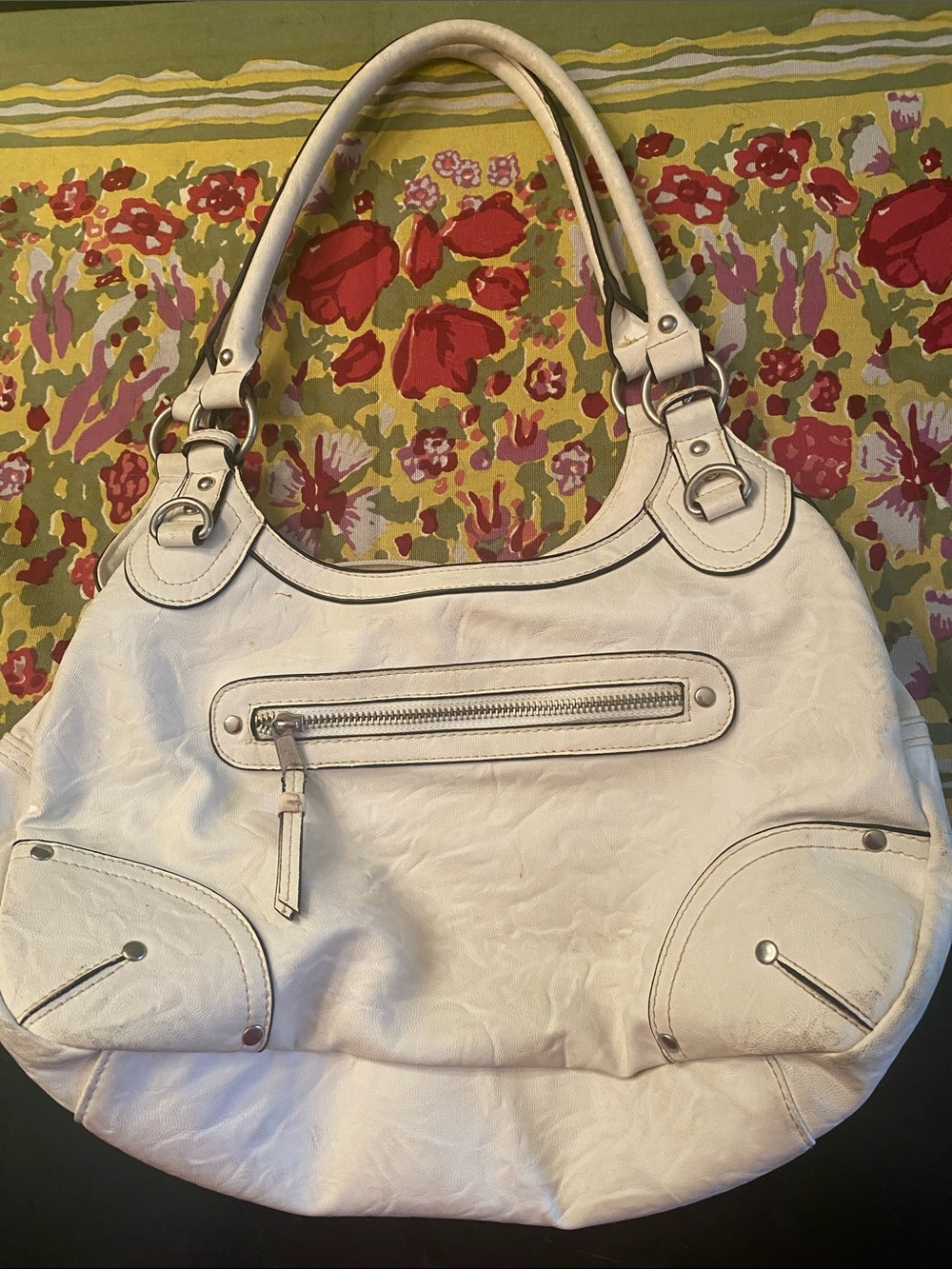 Cream colored purse with pockets
